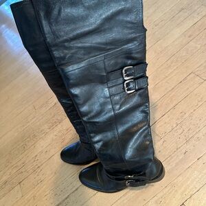 Sleek Black leather Knee-high Boots with Double Buckle Detail